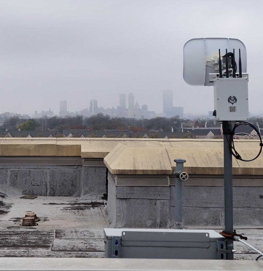 G1 sensor on a rooftop, with the Tulsa skyline behind it
